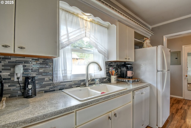 385 S Green St, Heppner, OR 97836 - kitchen featuring white appliances, electric panel, light countertops, backsplash, and crown molding