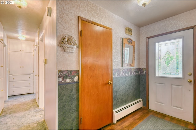 385 S Green St, Heppner, OR 97836 - entrance foyer featuring a baseboard radiator and wood finished floors