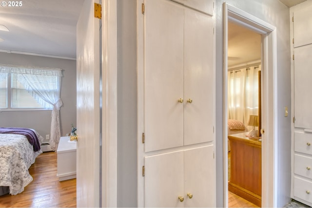 385 S Green St, Heppner, OR 97836 - bathroom with wood finished floors, a baseboard heating unit, ensuite bath, and crown molding
