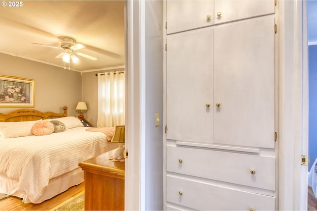 385 S Green St, Heppner, OR 97836 - bedroom with light wood-style flooring, a ceiling fan, a closet, and crown molding