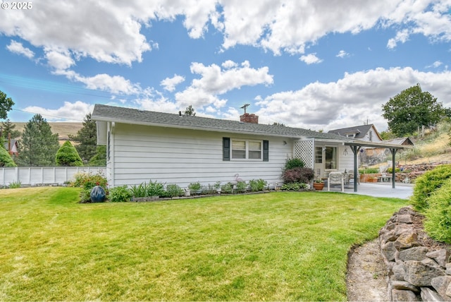 385 S Green St, Heppner, OR 97836 - back of house featuring a patio area and a chimney
