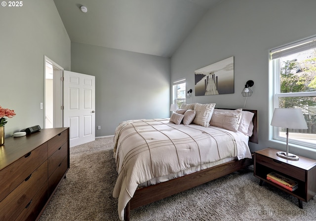 carpeted bedroom featuring high vaulted ceiling and baseboards