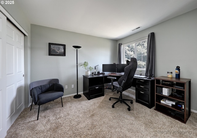 office space featuring visible vents, baseboards, and carpet
