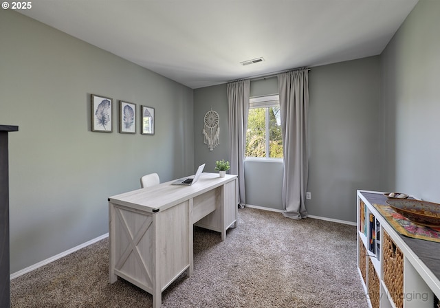 carpeted home office with baseboards and visible vents
