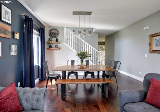 dining room with baseboards, stairway, wood finished floors, and a healthy amount of sunlight