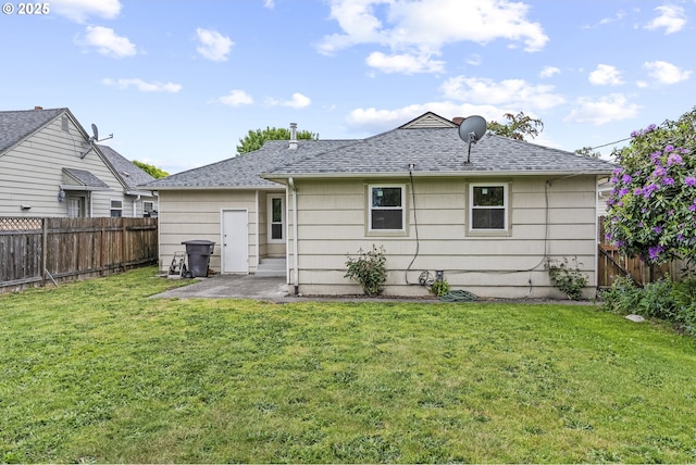 1041 19th Ave, Longview, WA 98632 - back of property featuring a shingled roof and a patio