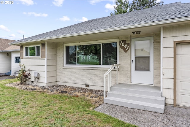 1041 19th Ave, Longview, WA 98632 - doorway to property with roof with shingles, a lawn, and brick siding
