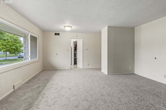 1041 19th Ave, Longview, WA 98632 - carpeted empty room featuring a textured ceiling and baseboards