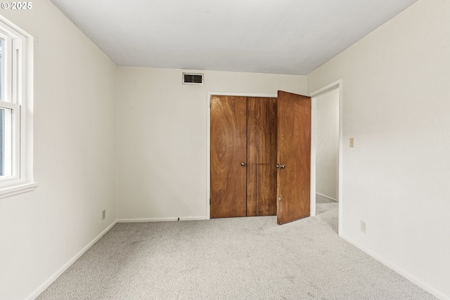 1041 19th Ave, Longview, WA 98632 - unfurnished bedroom with carpet floors, a closet, and baseboards