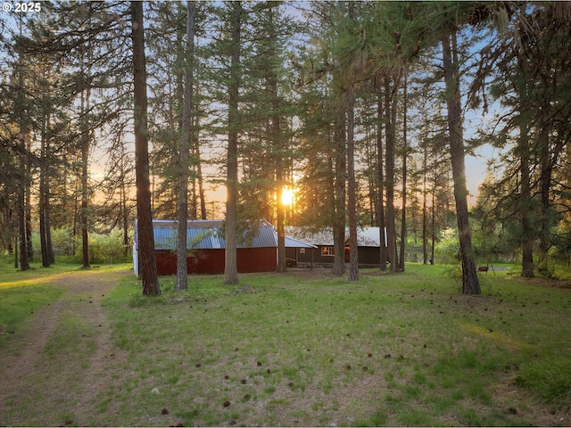 74576 Thompson Rd, Elgin, OR 97827 - yard at dusk with a yard, an outbuilding, and a pole building