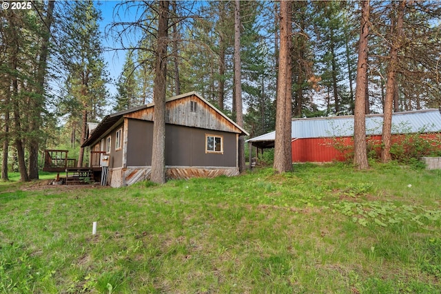 74576 Thompson Rd, Elgin, OR 97827 - view of green lawn with a deck and an outbuilding