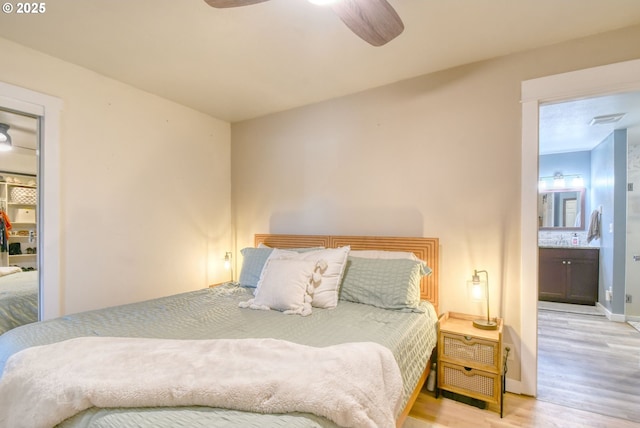 4303 SW Sheridan Ave, Pendleton, OR 97801 - bedroom featuring light wood finished floors, ensuite bath, baseboards, and ceiling fan