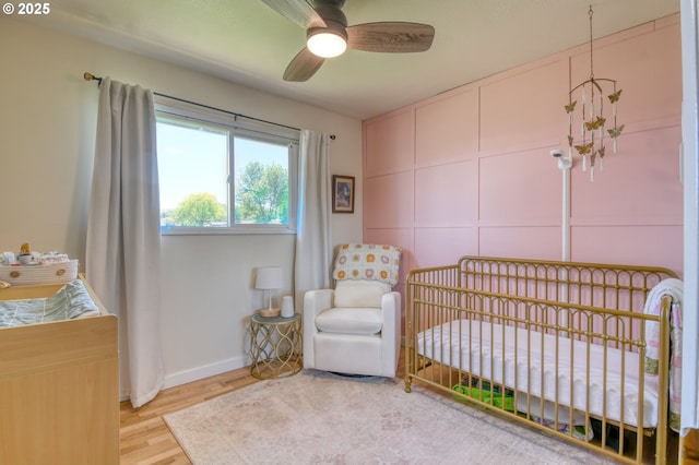4303 SW Sheridan Ave, Pendleton, OR 97801 - bedroom featuring a nursery area, wood finished floors, and baseboards