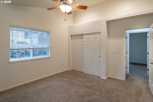 unfurnished bedroom with carpet, a closet, and ceiling fan