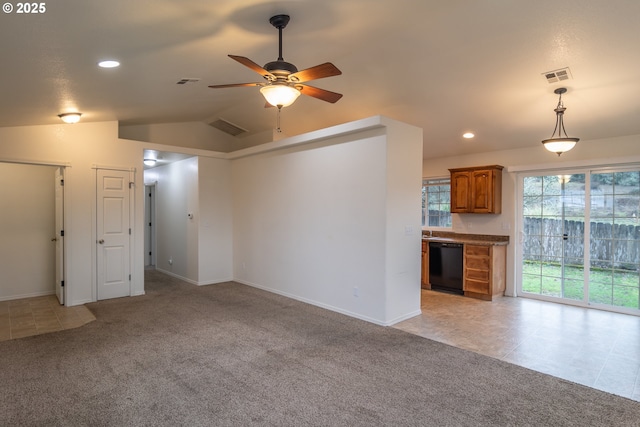 unfurnished living room featuring ceiling fan, light carpet, and vaulted ceiling