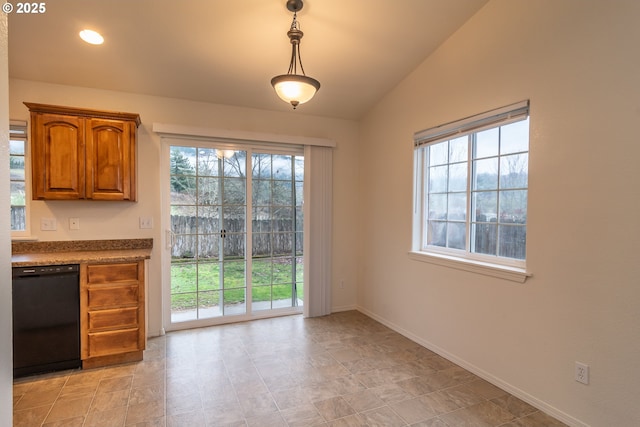 unfurnished dining area with plenty of natural light and lofted ceiling