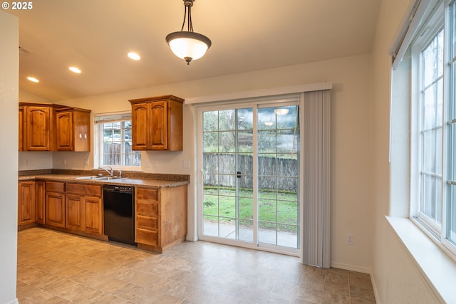 kitchen featuring plenty of natural light, sink, decorative light fixtures, and black dishwasher