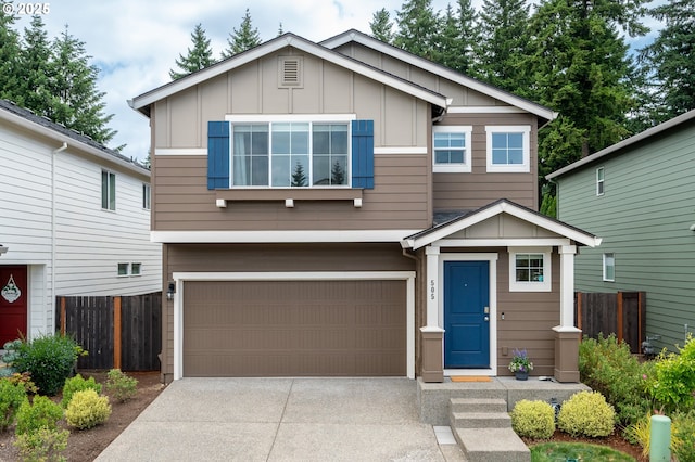 505 NE 138th Pl, Vancouver, WA 98684 - view of front of home with board and batten siding, a garage, and driveway