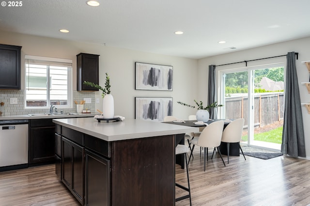505 NE 138th Pl, Vancouver, WA 98684 - kitchen featuring dishwasher, a breakfast bar, plenty of natural light, tasteful backsplash, and recessed lighting