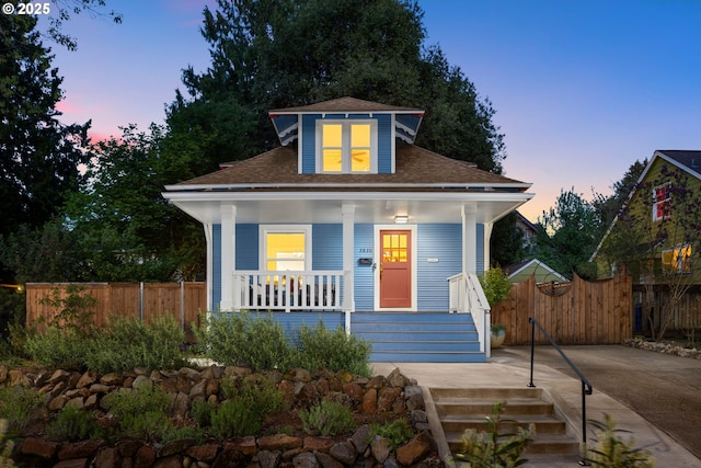 2820 SE 47th Ave, Portland, OR 97206 - bungalow featuring a porch, fence, and roof with shingles
