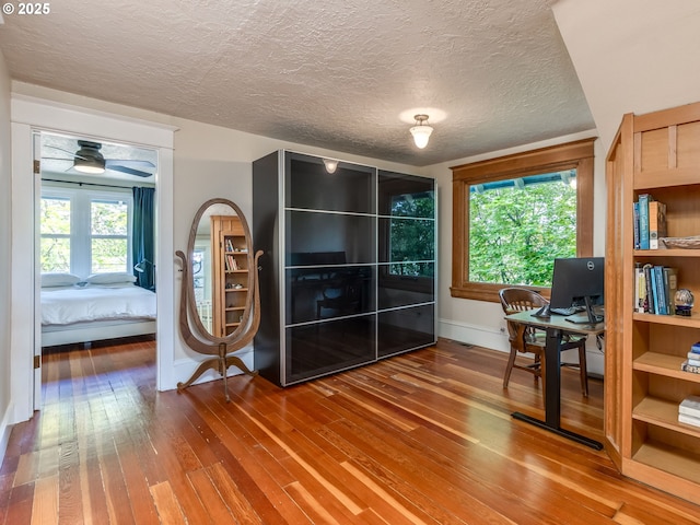 2820 SE 47th Ave, Portland, OR 97206 - office space featuring a healthy amount of sunlight, baseboards, hardwood / wood-style flooring, and a textured ceiling