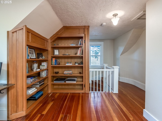 2820 SE 47th Ave, Portland, OR 97206 - additional living space with baseboards, a textured ceiling, and dark wood finished floors
