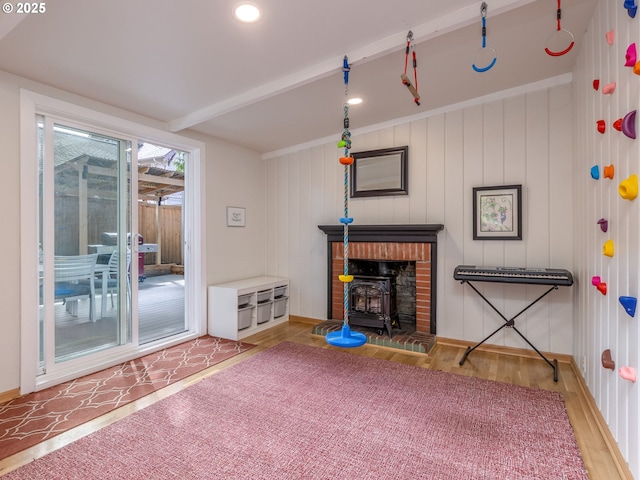 2820 SE 47th Ave, Portland, OR 97206 - living room featuring baseboards, wood finished floors, and a wood stove