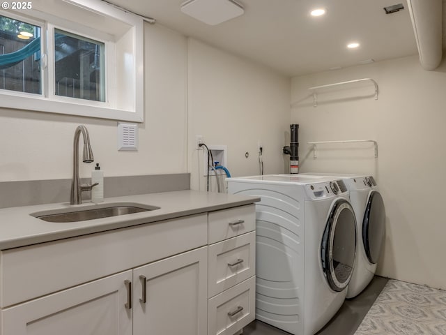 2820 SE 47th Ave, Portland, OR 97206 - washroom with cabinet space, recessed lighting, washing machine and dryer, and a sink