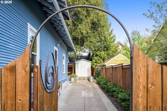 2820 SE 47th Ave, Portland, OR 97206 - view of property exterior featuring a storage shed, fence, an outdoor structure, and a patio area