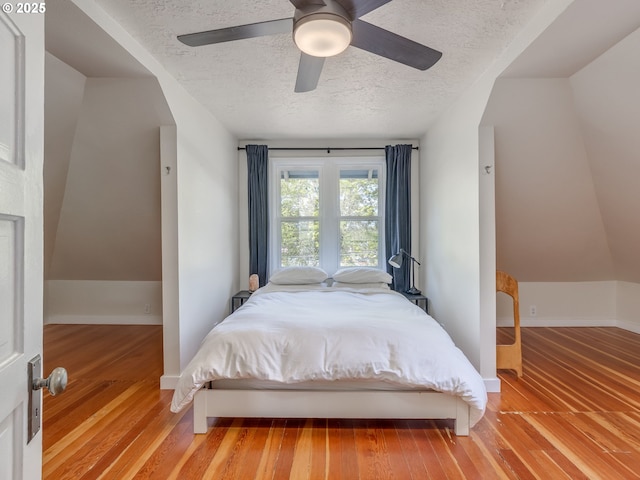 2820 SE 47th Ave, Portland, OR 97206 - bedroom featuring baseboards, a ceiling fan, a textured ceiling, and wood finished floors