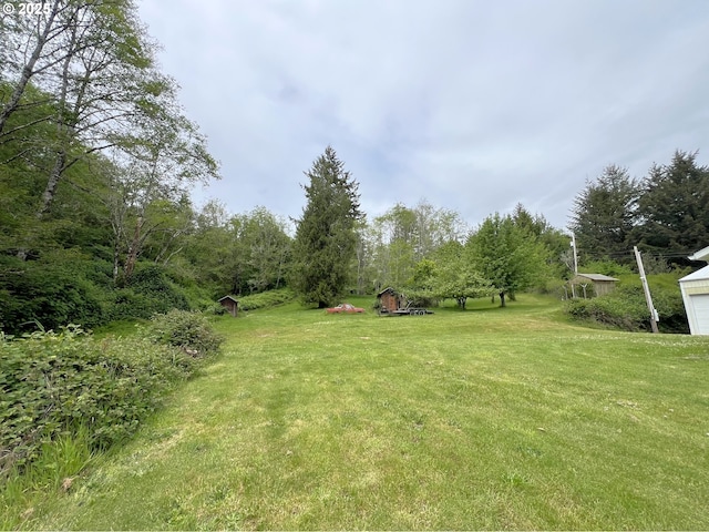 94031 Green Acres Ln, Coos Bay, OR 97420 - view of green lawn with a garage