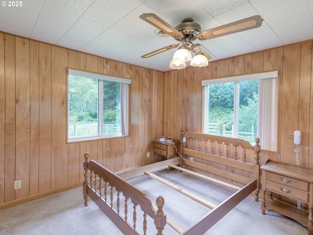 94031 Green Acres Ln, Coos Bay, OR 97420 - bedroom featuring carpet, wood walls, and baseboards