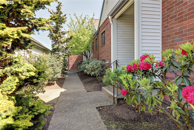view of property exterior with brick siding