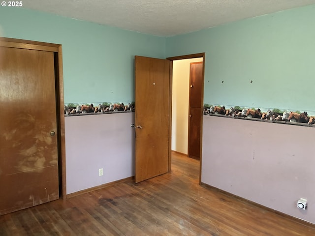 33962 Church Rd, Warren, OR 97053 - empty room with wood finished floors and a textured ceiling
