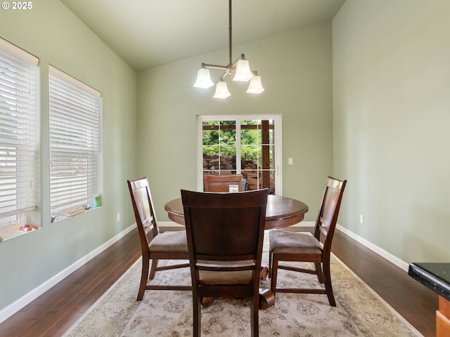 14829 S Quail Crest Ln, Oregon City, OR 97045 - dining space with wood finished floors, high vaulted ceiling, and a chandelier
