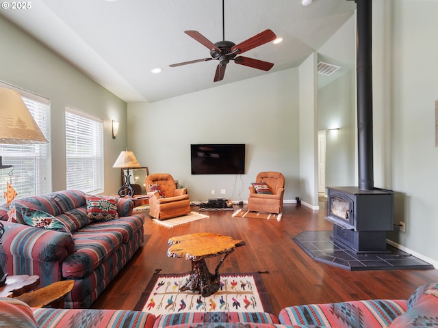 14829 S Quail Crest Ln, Oregon City, OR 97045 - living area with lofted ceiling, a wood stove, dark wood finished floors, ceiling fan, and recessed lighting
