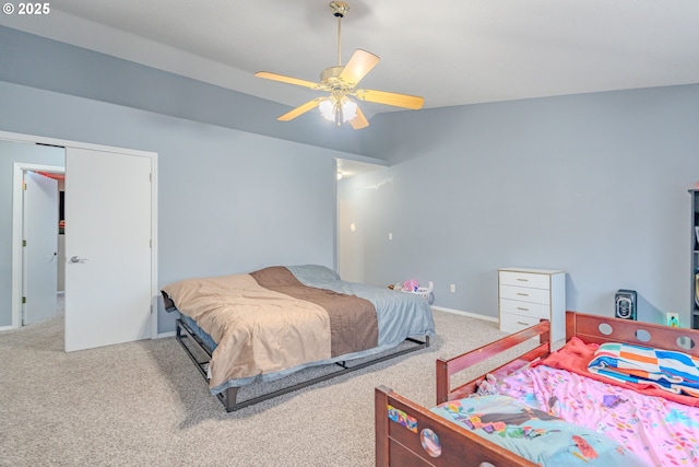 bedroom with ceiling fan, baseboards, and carpet flooring