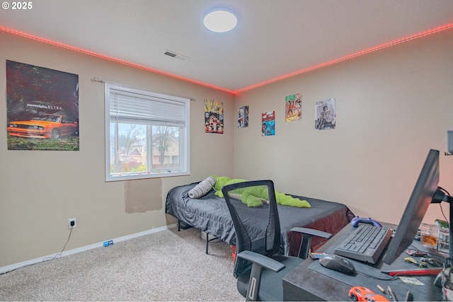 bedroom featuring baseboards, visible vents, ornamental molding, and carpet flooring