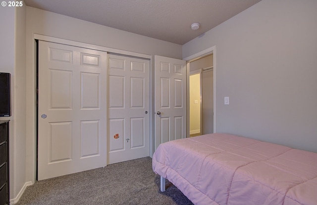 carpeted bedroom with a closet