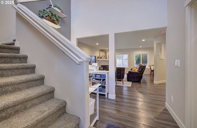 stairs with wood-type flooring