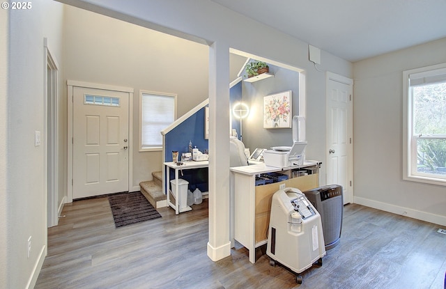 entryway with light hardwood / wood-style floors