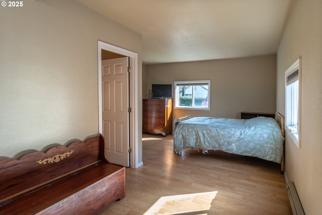 164 Pippin Ave, Roseburg, OR 97471 - bedroom with a baseboard radiator, baseboards, and light wood-type flooring
