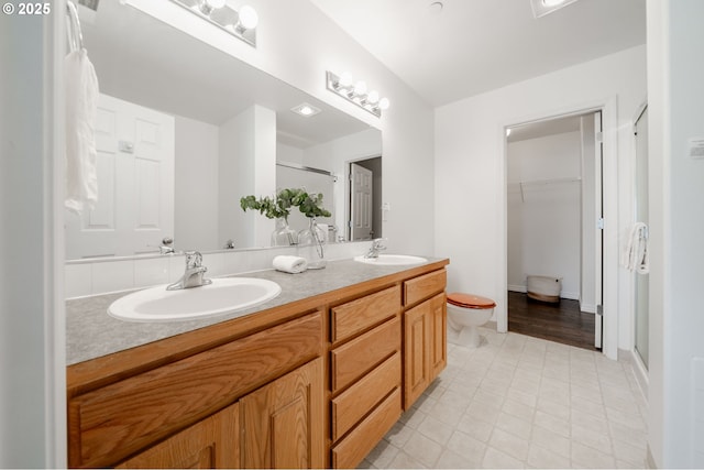 5700 NE 82nd Ave Unit C15, Vancouver, WA 98662 - bathroom featuring double vanity, a sink, toilet, and a shower stall
