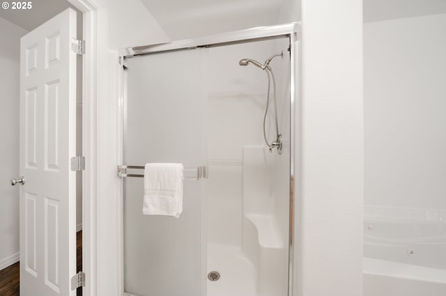 5700 NE 82nd Ave Unit C15, Vancouver, WA 98662 - full bathroom with a stall shower, a garden tub, and wood finished floors