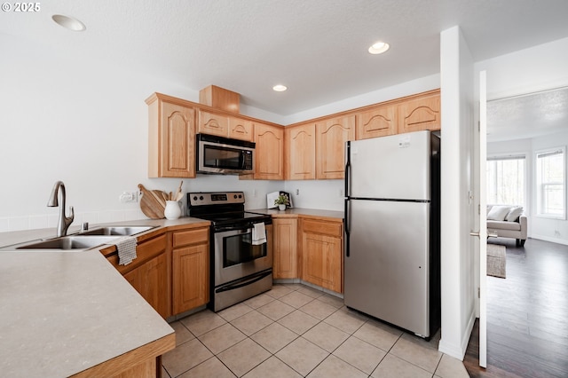 5700 NE 82nd Ave Unit C15, Vancouver, WA 98662 - kitchen with light countertops, recessed lighting, light brown cabinetry, a sink, and appliances with stainless steel finishes
