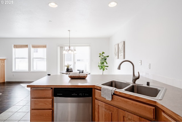 5700 NE 82nd Ave Unit C15, Vancouver, WA 98662 - kitchen featuring light countertops, a sink, dishwasher, a peninsula, and an inviting chandelier