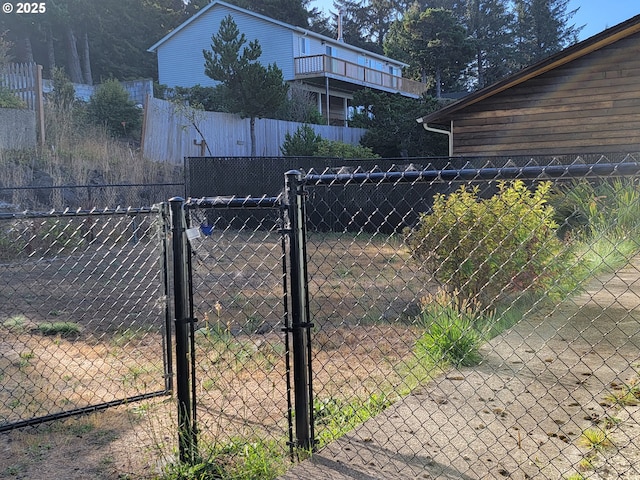 view of gate with fence