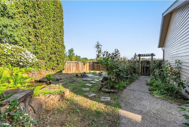 view of yard featuring a gate and fence