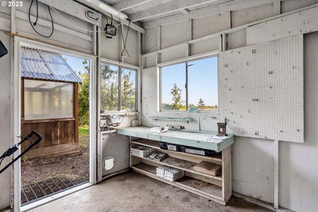 sunroom featuring a workshop area