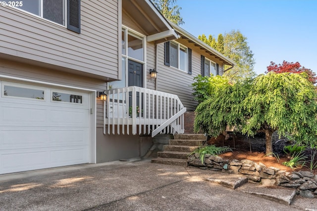 doorway to property featuring a garage